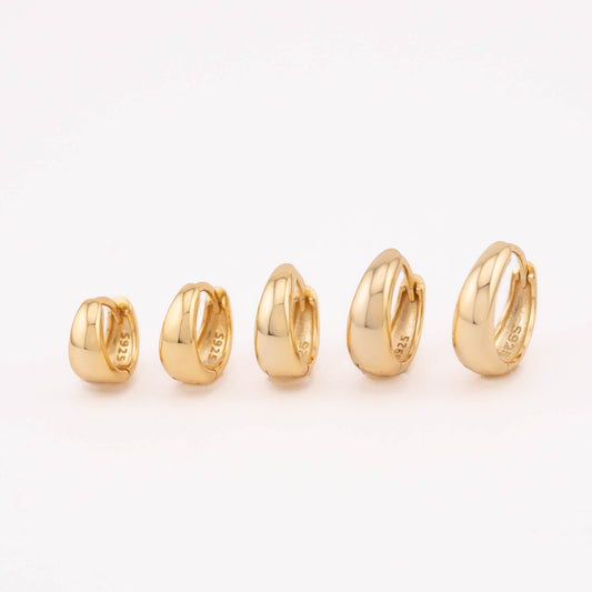  A set of small tapered hoop earrings in 14K gold vermeil for both men and women, lined up neatly next to each other. The earrings vary in size, ranging from 6mm to 10mm, offering a variety of options for different preferences and styles.