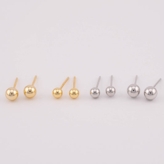 Front view photo featuring four sets of gold and silver ball earrings with two different sizes each, arranged side by side for size comparison. Suitable for sale as a set, offering versatility in size options and a stylish addition to any jewelry collection.