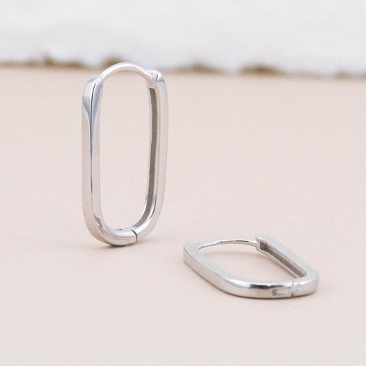 Sterling silver endless hoop earrings - displayed upright and lying flat, showcasing classic angles and design detail