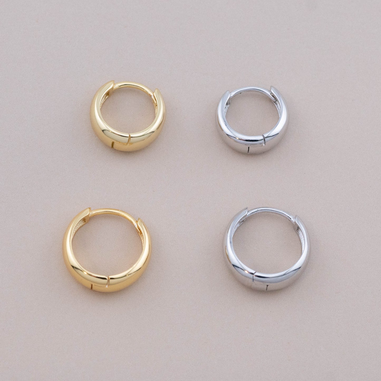 Sterling silver and gold sleeper earrings in two sizes, side by side, top view showing full details.