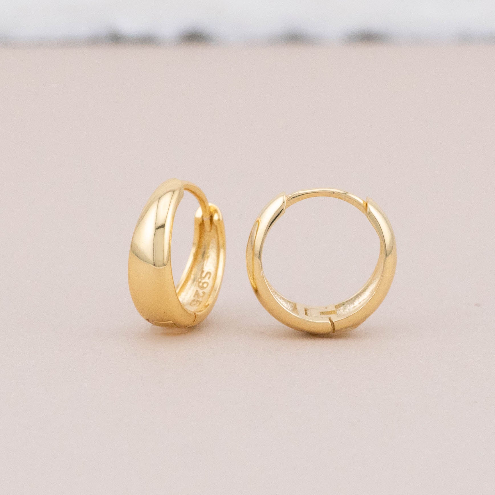 Sterling silver sleeper earrings with 14K gold plating, shown front angled view, detailed display.